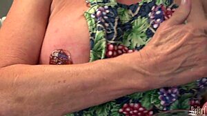 Mature housewife Raehart dives into kitchen pleasure with big tits in uniform. She explores every intense moment.