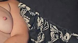 She teases her pussy with a dildo until she cums hard in the bedroom