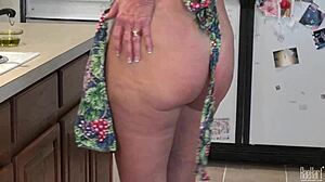 Mature housewife Raehart dives into kitchen pleasure with big tits in uniform. She explores every intense moment.