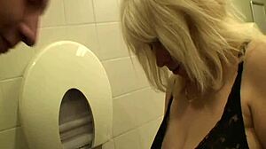 A Blonde Matures Sexcapade In A Public Mall Restroom With Blowjob Cumshot Action