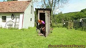 Piss-loving redhead gets cum sprayed outdoors