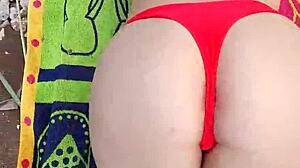 beautiful brunette gives deepthroat blowjob outdoors by the river in close-up