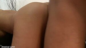 Jessica Lynn lies bent over in missionary as he licks her shaved hairless pussy. Then she gets a massive cumshot squirting all over her big fake tits in doggystyle.