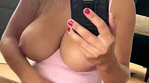 Selfie masturbates boldly in mirror wearing sexy panties and socks with bouncing boobs
