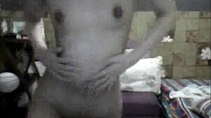 sexy filipina strips teasing small tits in ripped clothes dance