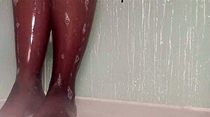Wet nylon feet tease seductively in steamy shower play