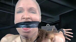 hey, check out this breast bondage sub gagged and bound on the punishing sex machine