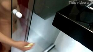 latina milf's huge natural tits shine under shower