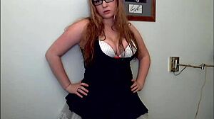 redhead slut teases tits and ass before clothes rip in striptease frenzy