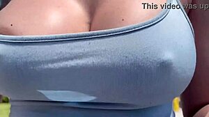 Artemisia Love struts outdoors braless with big tits bouncing