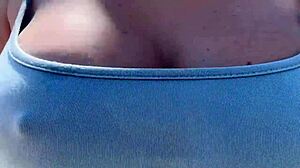 Artemisia Love struts outdoors braless with big tits bouncing