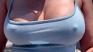 Artemisia Love struts outdoors braless with big tits bouncing