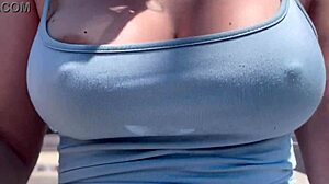 Artemisia Love struts outdoors braless with big tits bouncing
