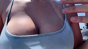 Artemisia Love struts outdoors braless with big tits bouncing