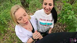 Girlfriends slurp huge cocks in outdoor threesome