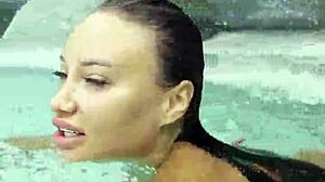 Monika Fox struts sexy pink bikini poolside flaunting fake tits tattoos outdoors