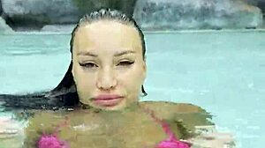 Monika Fox struts sexy pink bikini poolside flaunting fake tits tattoos outdoors