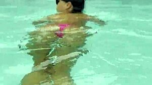 Monika Fox struts sexy pink bikini poolside flaunting fake tits tattoos outdoors