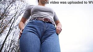 milf teases her big cameltoe through tight jeans outside