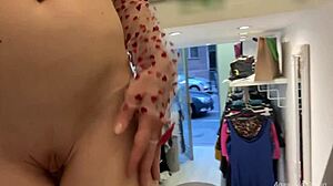 Blonde flashes shaved pussy tits in open shop