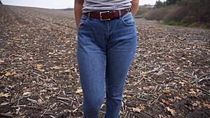 milf teases her big cameltoe through tight jeans outside