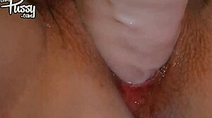 Girlfriend's dildo slams wet shaved pussy up close
