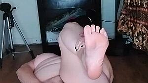 Hot milf stretches in tight yoga pants during early morning routine with big tits