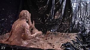 Glamorous babes slip and slide in messy mud wrestling chaos