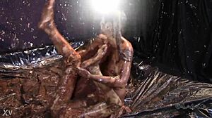 Glamorous babes slip and slide in messy mud wrestling chaos