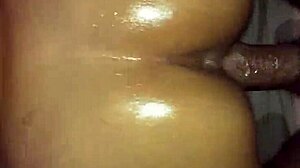 Prostitute shakes her oily buttocks hard and bold