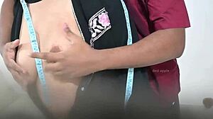 Doctor examines hijab-wearing Arab lady in hospital checkup