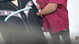 Doctor examines hijab-wearing Arab lady in hospital checkup