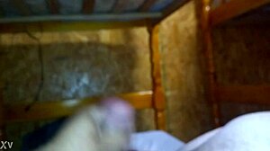 guy strokes his hard cock furiously on the bed