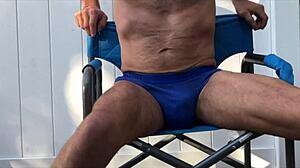 deep pelvic stretches in blue briefs on chair late oct 2024