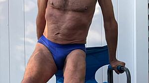 deep pelvic stretches in blue briefs on chair late oct 2024