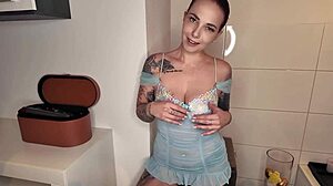 Horny redhead latex babe spreads big tits for you