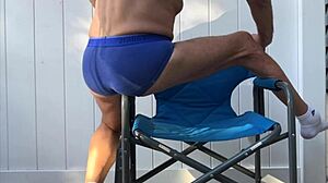 deep pelvic stretches in blue briefs on chair late oct 2024