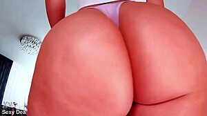 Oiled booty bounces sensually on dildo ride