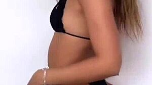 closer look at all-black bikini thongs in club?