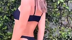 closer look at all-black bikini thongs in club?