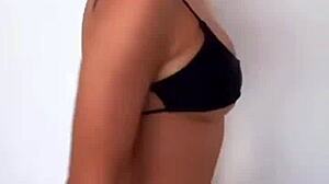 closer look at all-black bikini thongs in club?