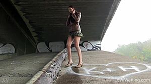 kitty squats outdoors unleashing golden stream solo