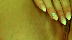 gorgeous blonde babe fingers her shaved pussy with toys