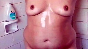 amateur girl strips teasingly during her steamy bath time