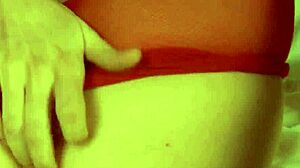 Redhead's shaved pussy throbs through pantyhose closeup