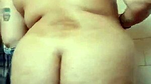 amateur girl strips teasingly during her steamy bath time