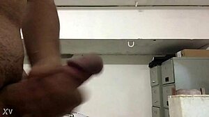Watch her stroke massive cock to explosive cumshot