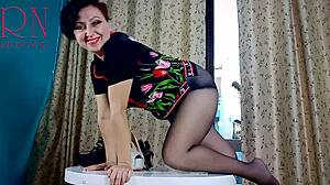 nice lady stripteases in pantyhose heels at round table