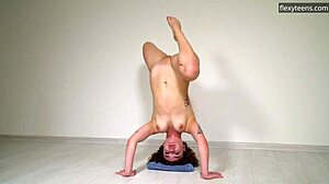 petite curly gymnast stretches nude on sofa showing flexible pussy