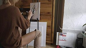 blonde babe in boots spreads legs painting her pretty pussy flower close-up